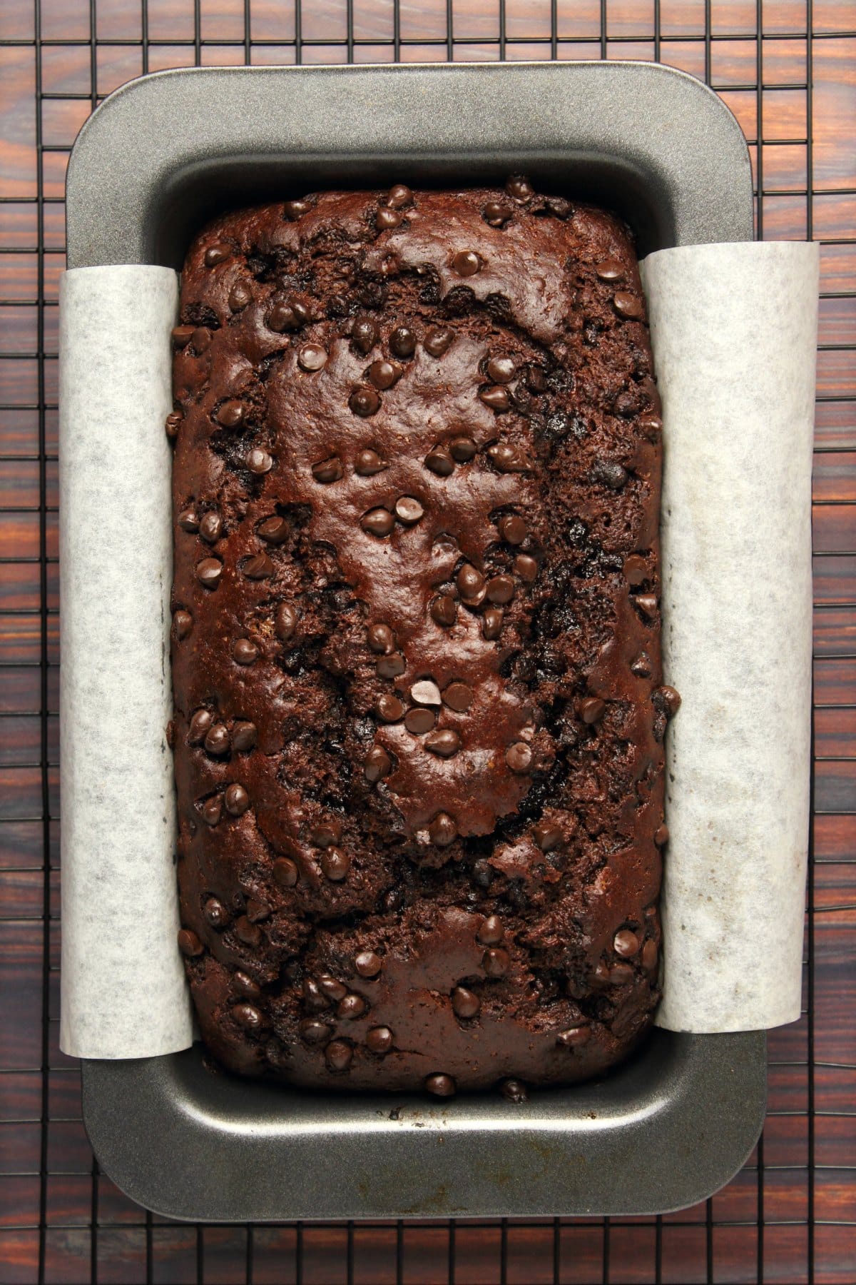 Freshly baked chocolate banana bread in a loaf pan.