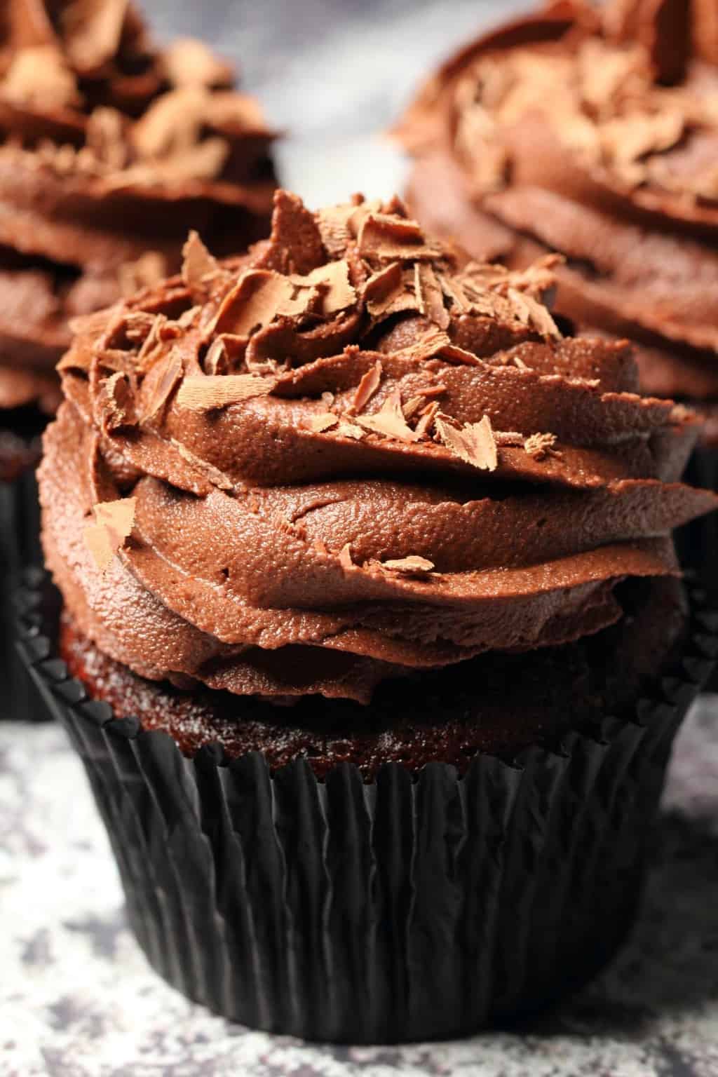 Classic vegan chocolate cupcakes topped with vegan chocolate buttercream and chocolate shavings. 
