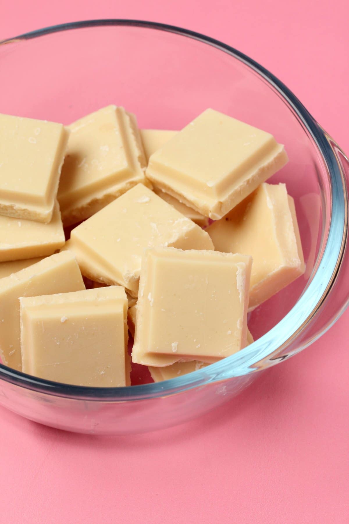 Vegan white chocolate in a glass microwave safe bowl.