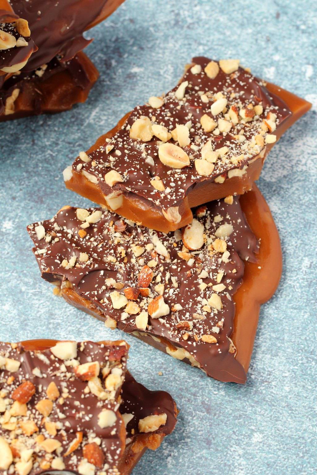 Vegan toffee topped with mixed nuts and vegan chocolate. 