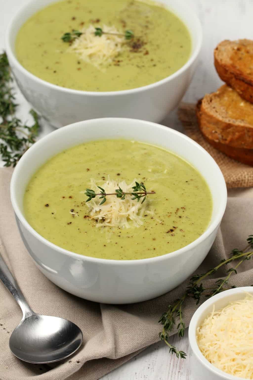 Vegan zucchini soup in white bowls. 