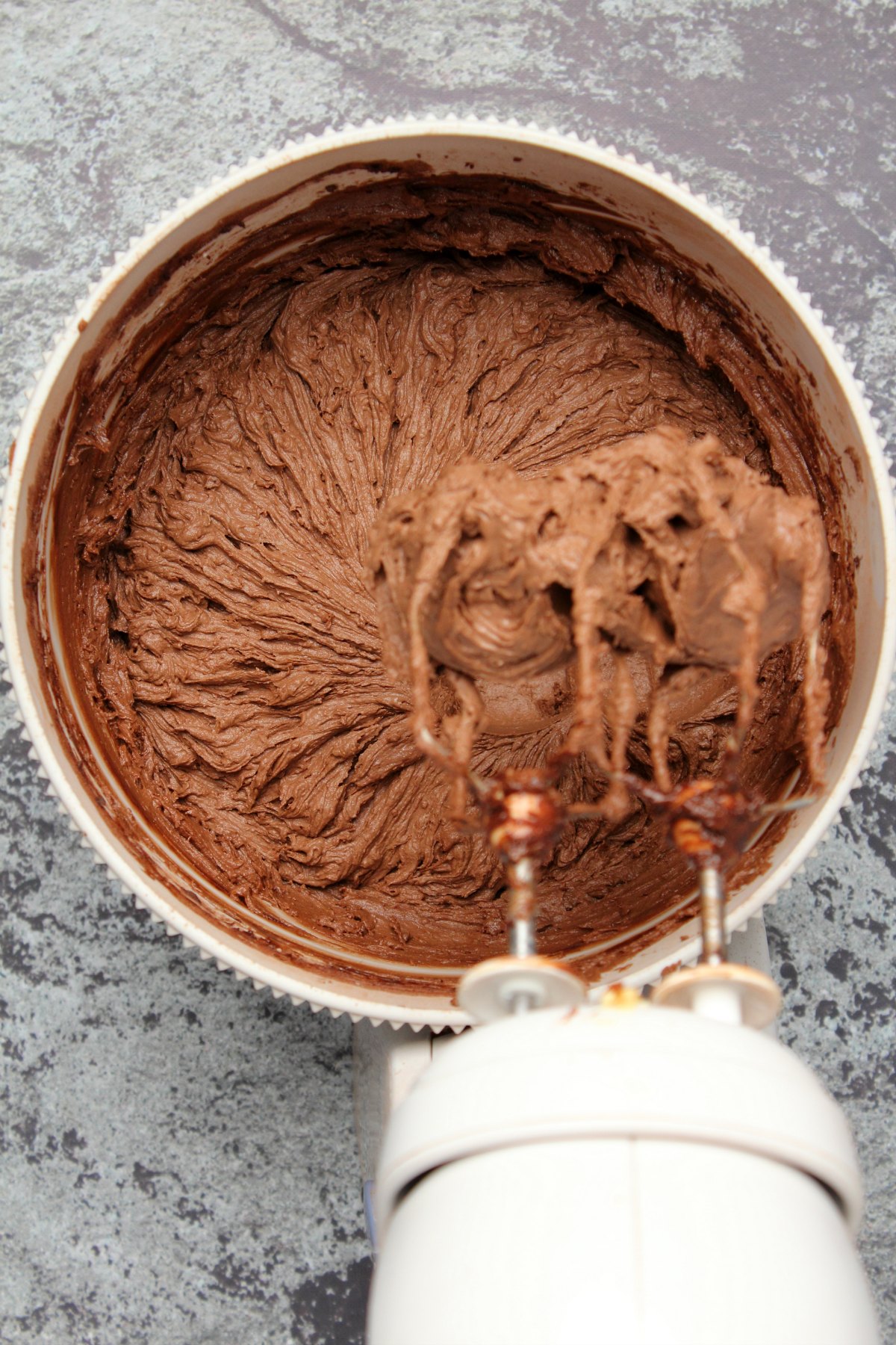 Vegan chocolate buttercream frosting in a stand mixer.