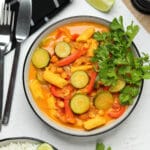 Vegan coconut curry in a bowl with fresh cilantro.