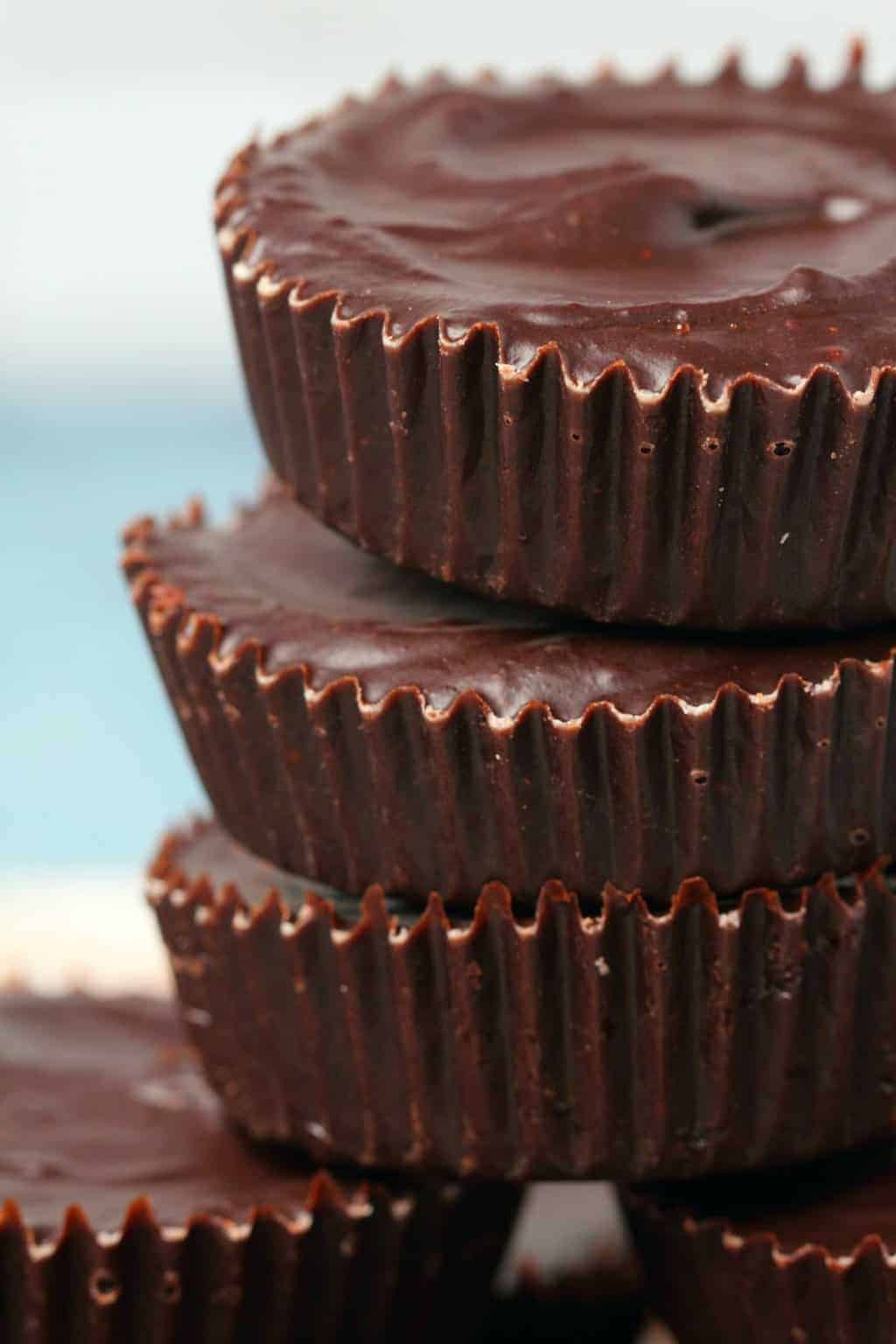 Vegan chocolate stacked up on top of each other. 