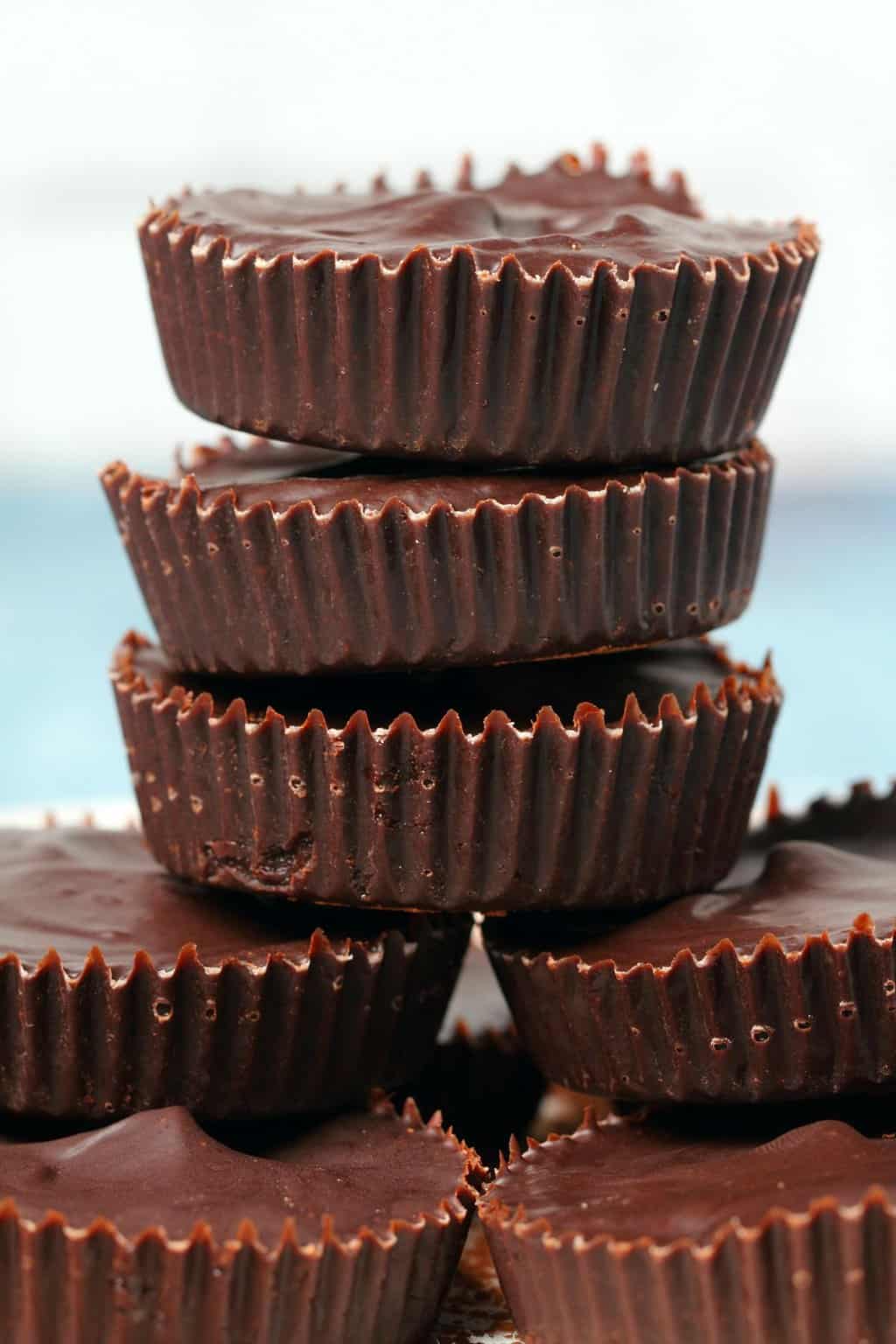Vegan chocolates stacked up on top of each other. 