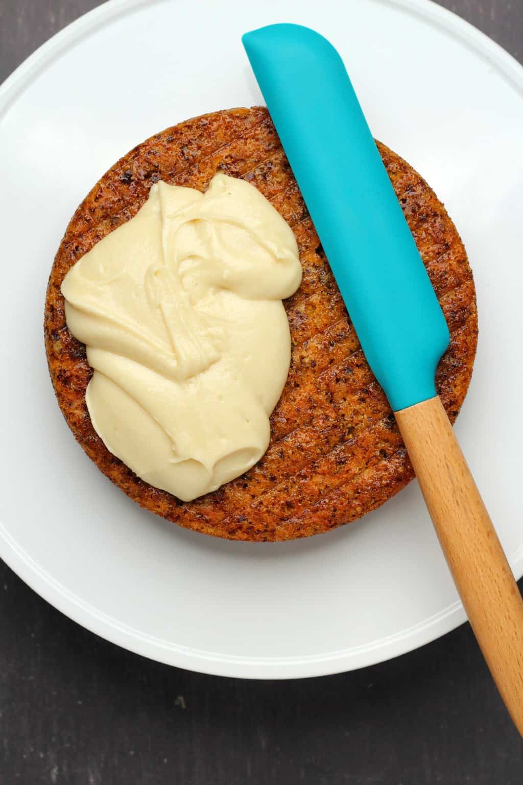 Vegan cream cheese frosting on a carrot cake. 