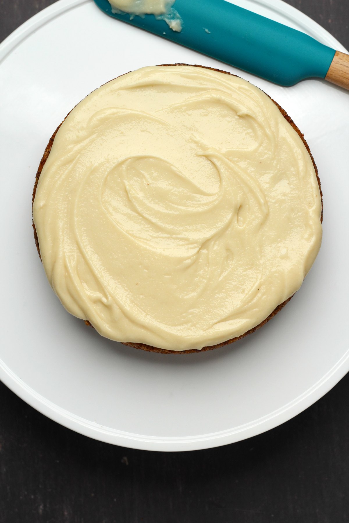 Vegan cream cheese frosting on a carrot cake. 