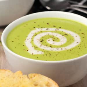 Vegan pea soup in a white bowl.
