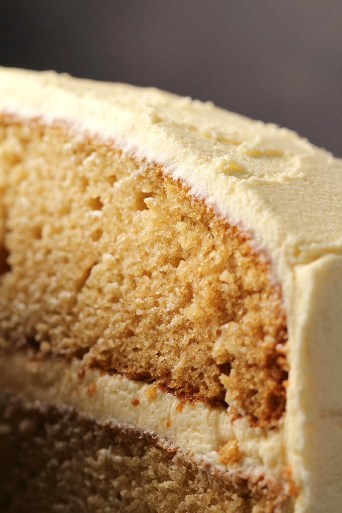 Vegan vanilla cake topped with vanilla buttercream.
