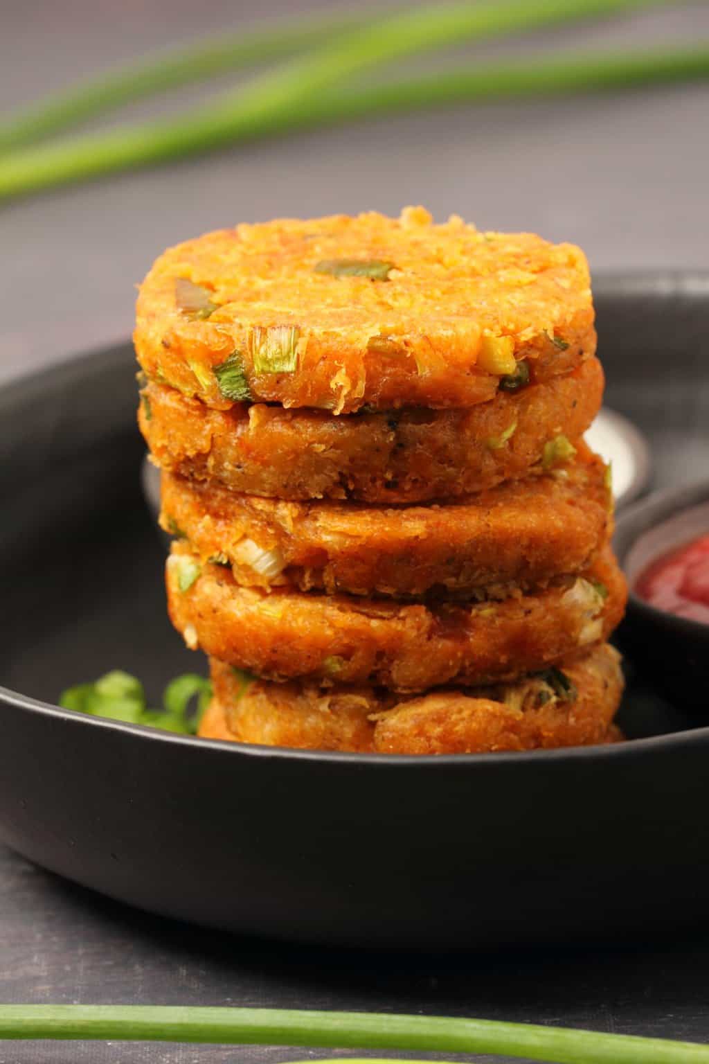 Vegan hash browns stacked up on top of each other. 