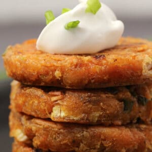 Vegan hash browns topped with vegan mayonnaise and chopped green onions.