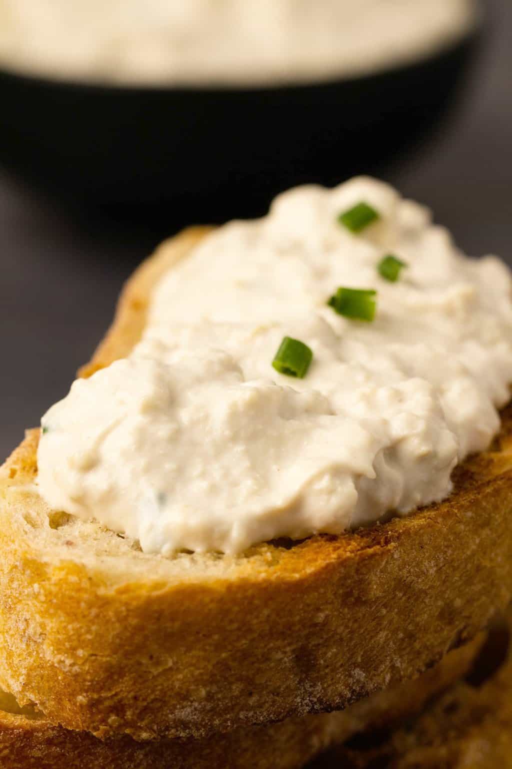 Vegan cottage cheese thickly spread on toasted ciabatta.