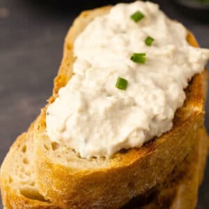 Vegan cottage cheese and chopped chives on toasted ciabatta.