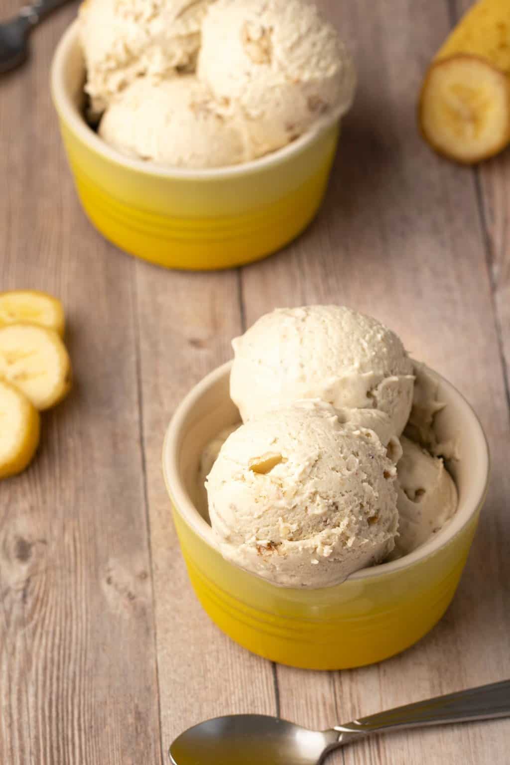 Vegan banana ice cream in yellow bowls. 