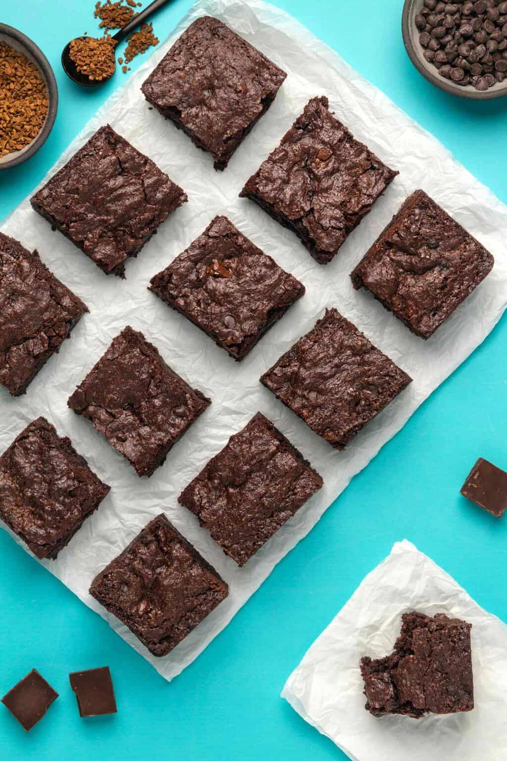 Vegan gluten free brownies on parchment paper. 