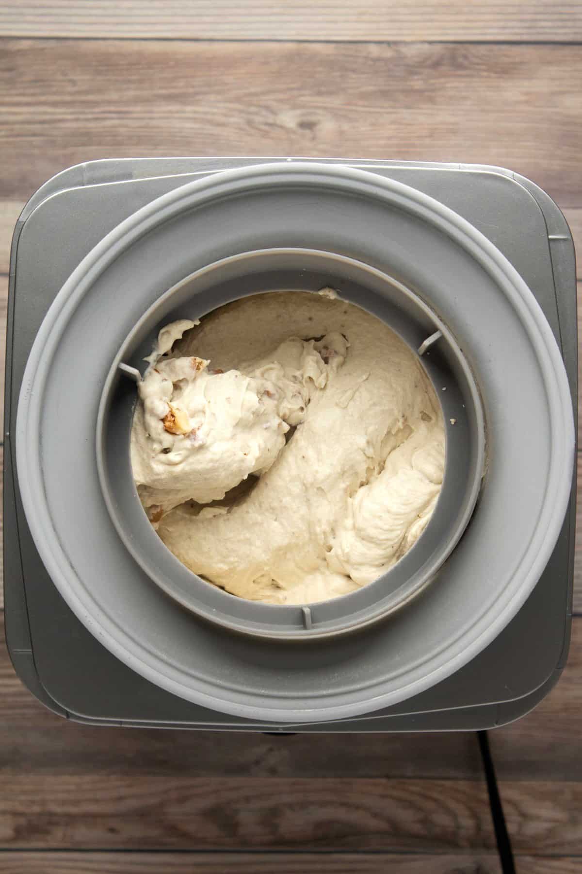 Churning banana ice cream in an ice cream machine.