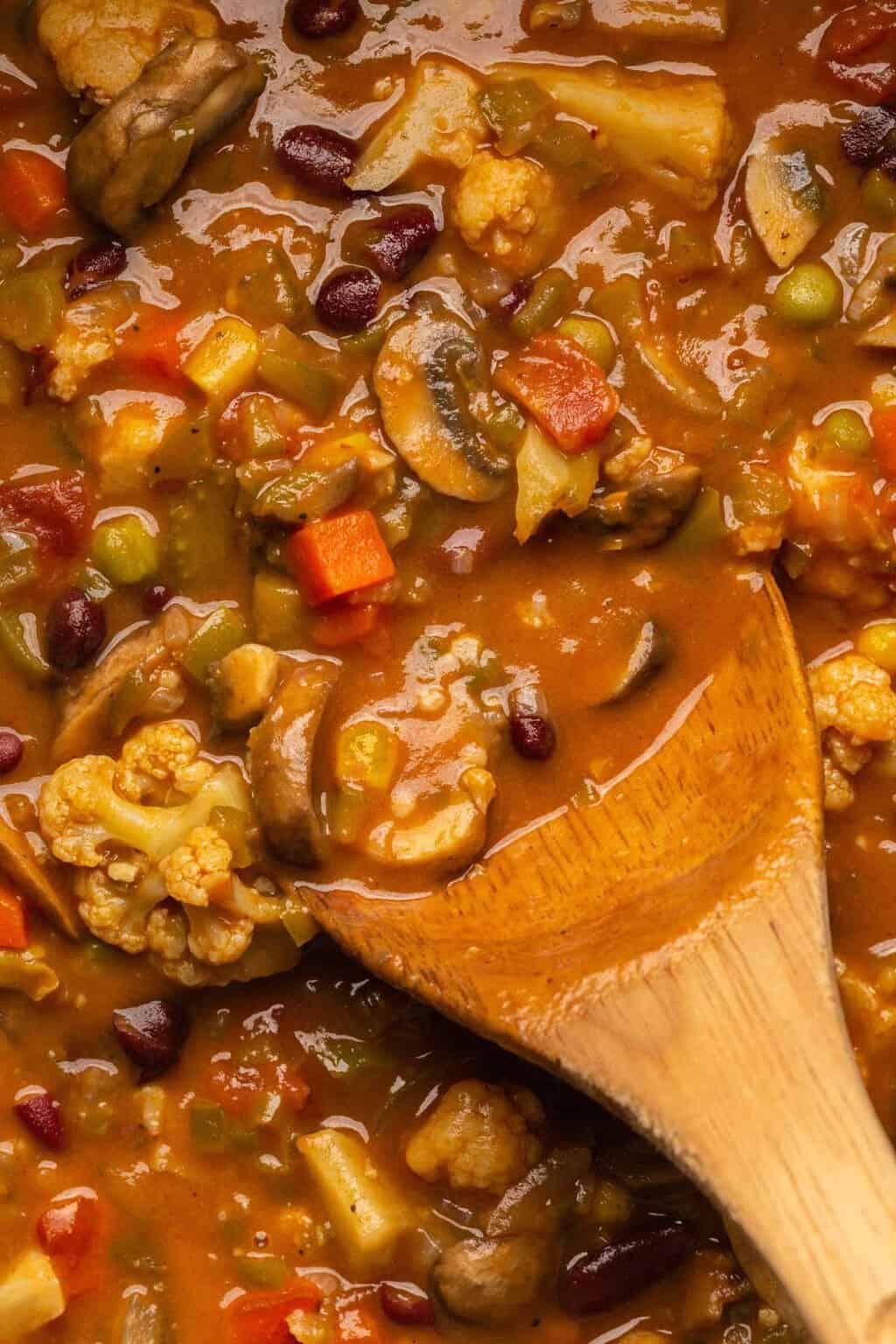 Vegan gumbo with a wooden spoon. 