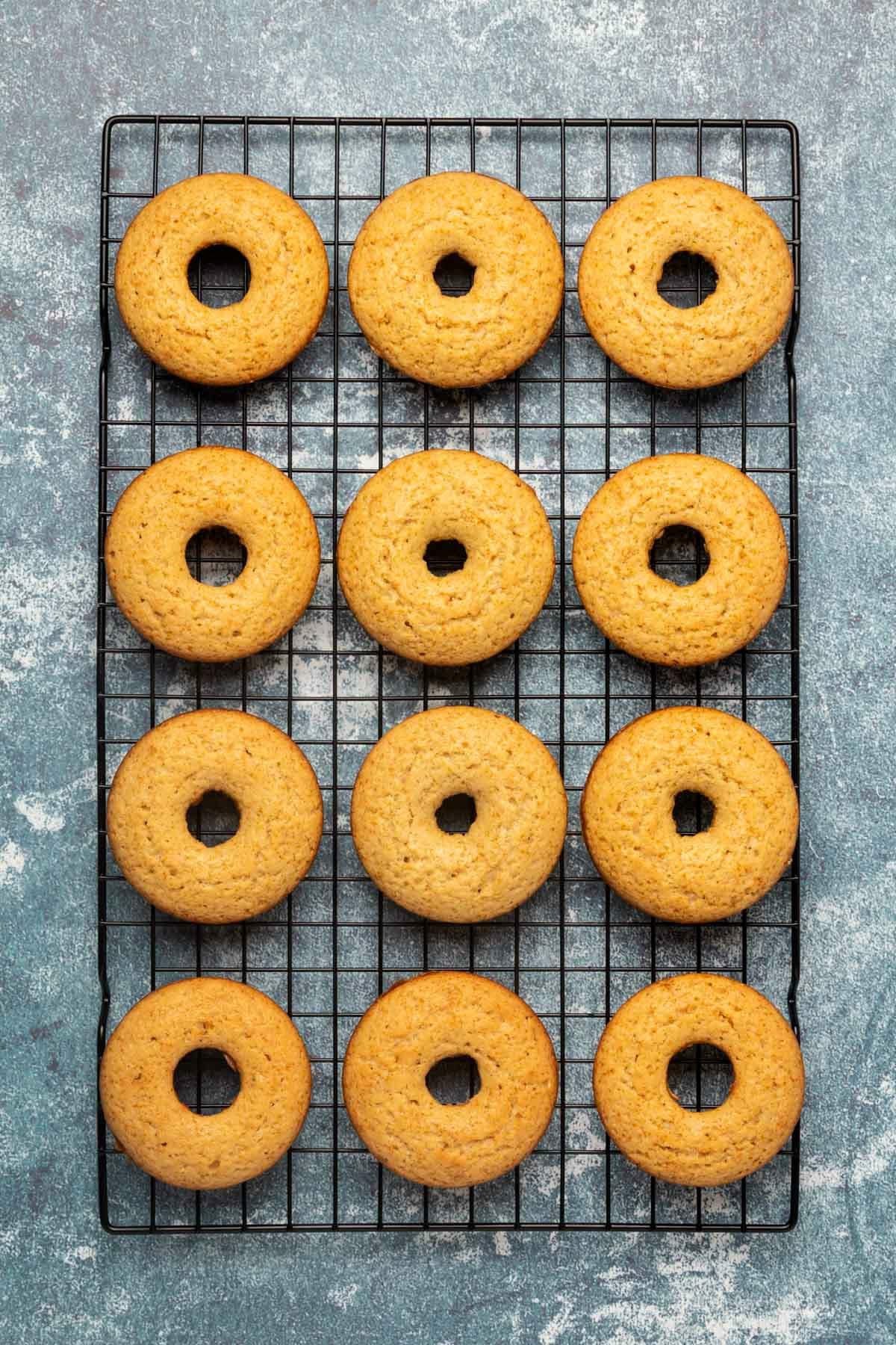 Donuts cooling on a wire cooling rack.