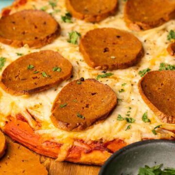 Vegan pepperoni on a pizza.
