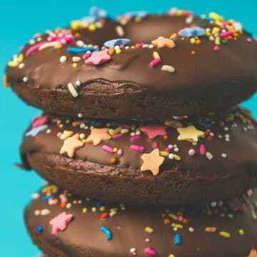 Vegan chocolate donuts in a stack.