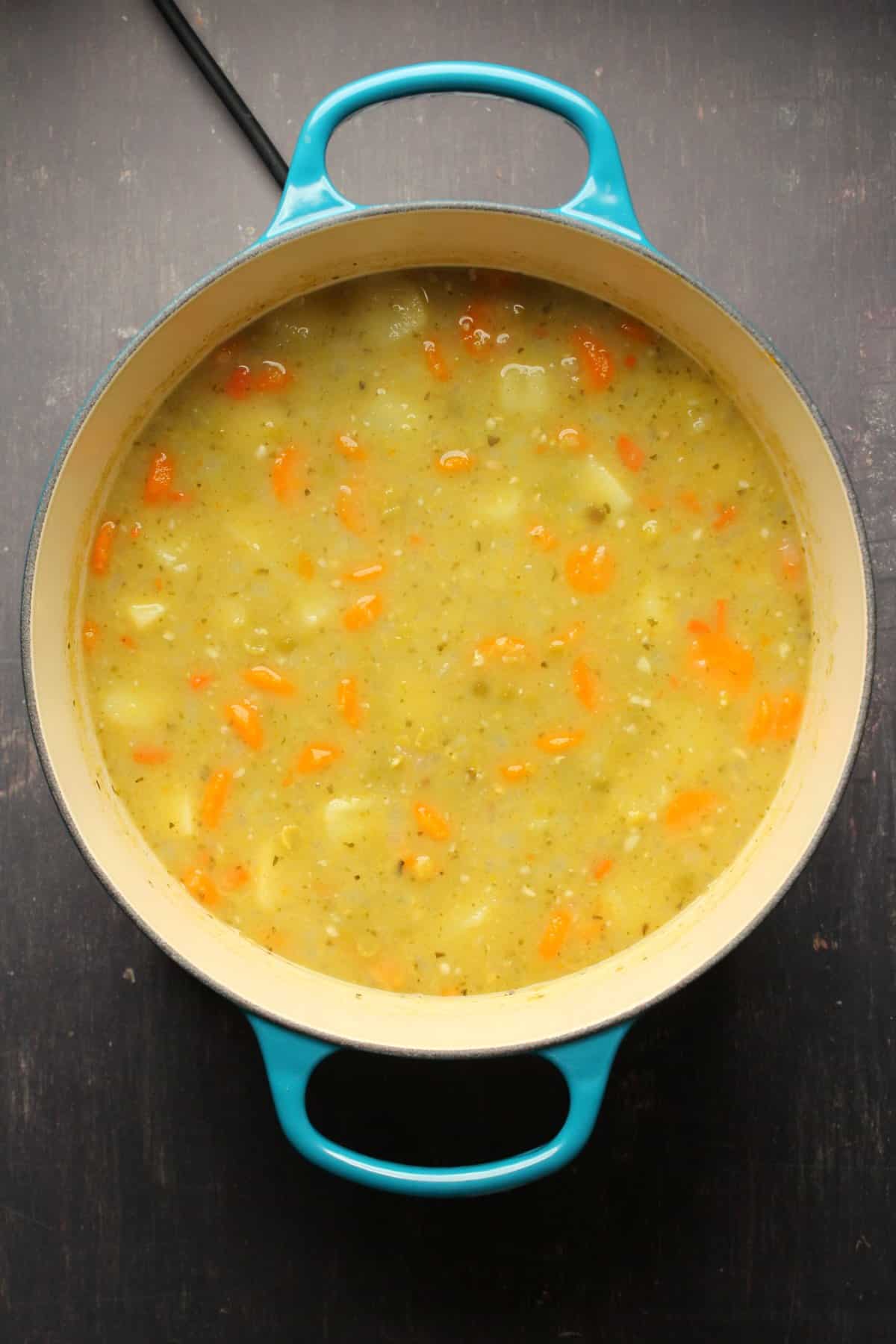 Cooked split pea soup in a pot. 