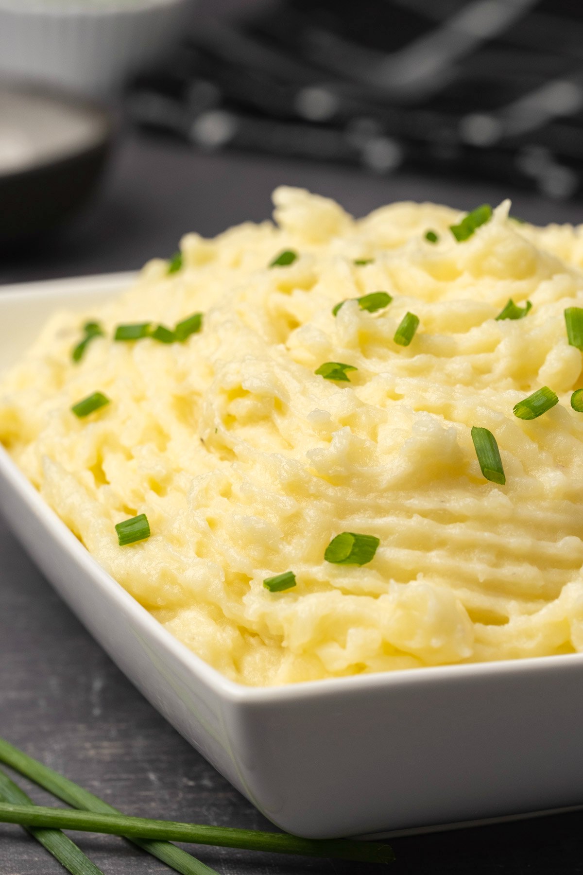 Vegan mashed potatoes topped with chopped chives. 