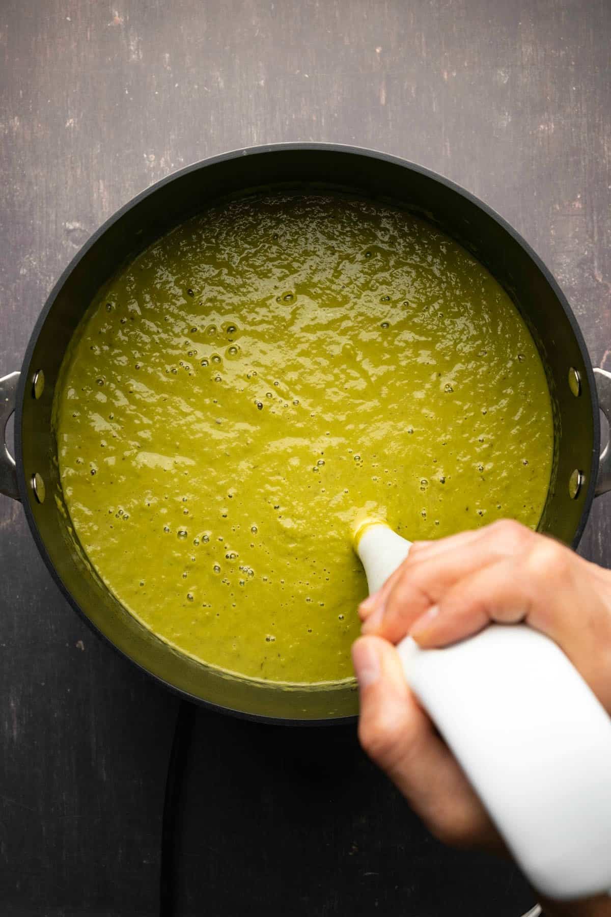 Immersion blending asparagus soup in the pot. 