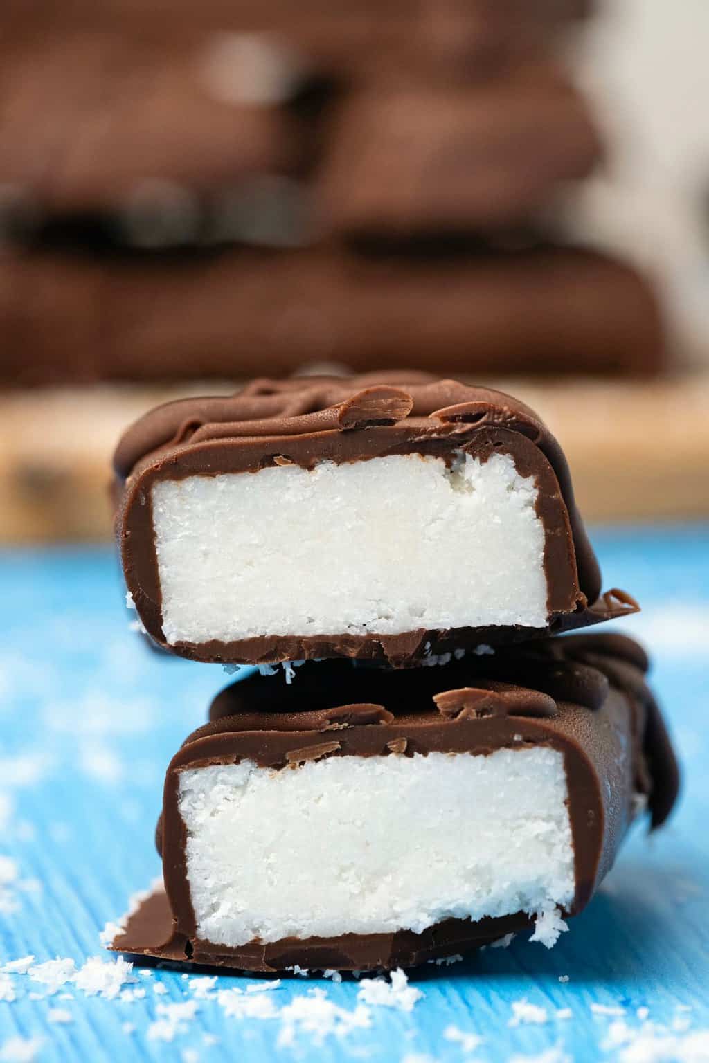 Vegan bounty bars cut in half and stacked up. 
