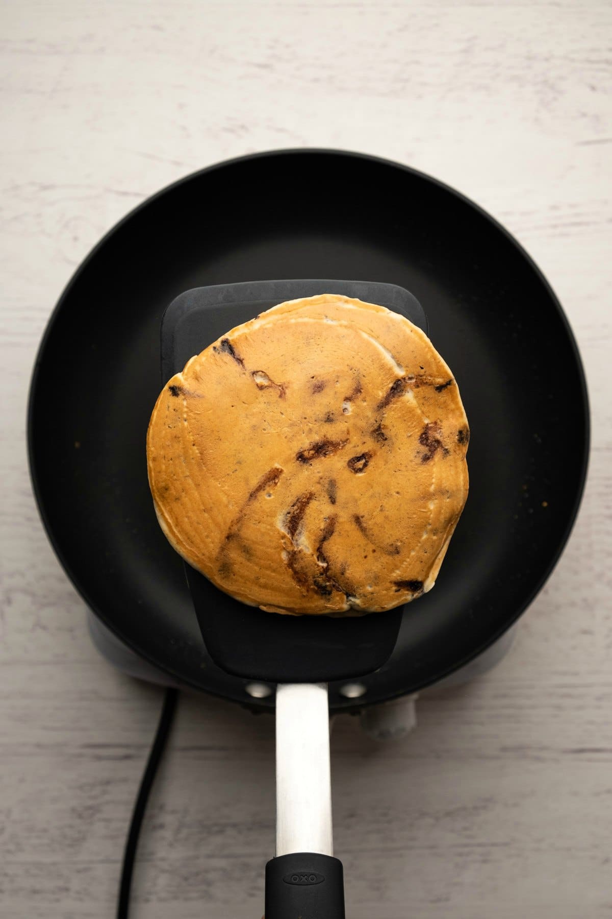Vegan peanut butter pancake on a spatula.