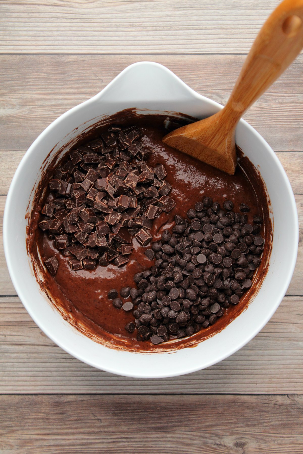 Chocolate chips and chocolate chunks added to mixing bowl.