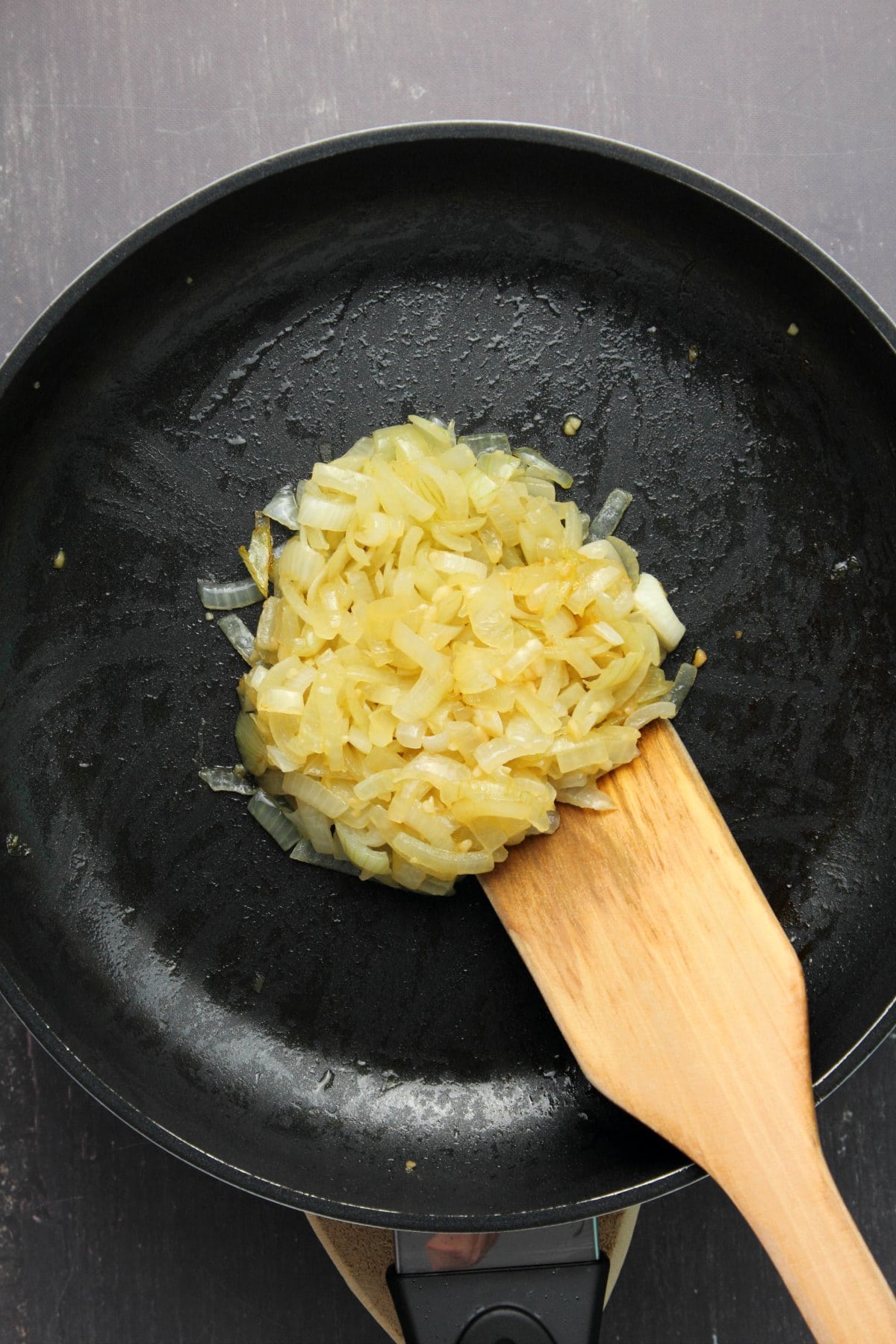 Sautéed onions in a frying pan.