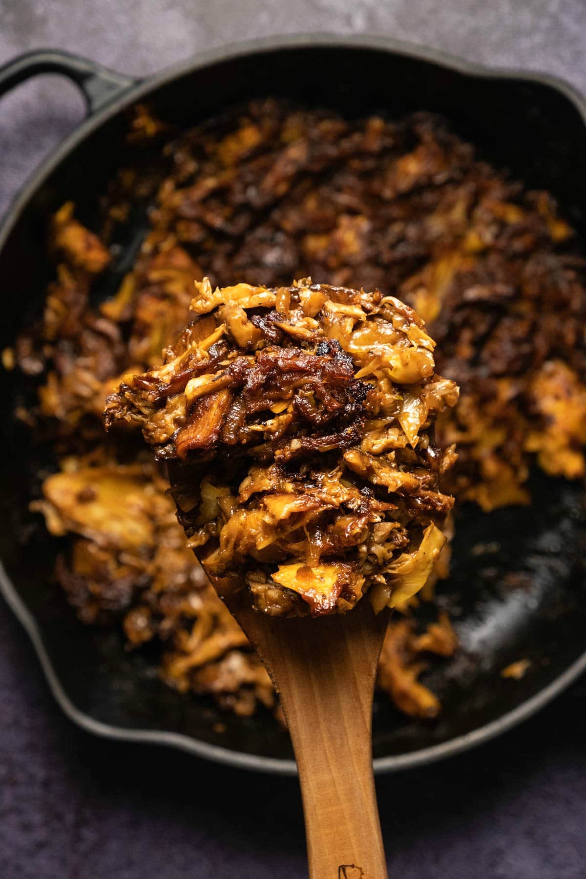 Baked mushroom and artichoke in a skillet.