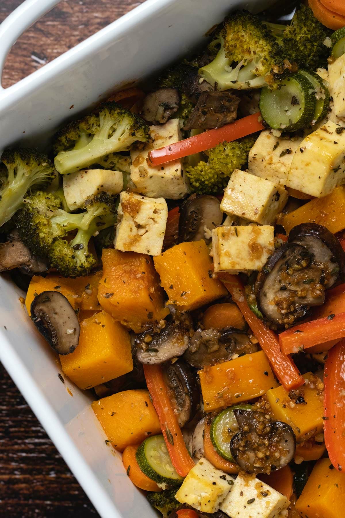 Vegetable casserole in a white baking dish.