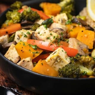 Vegetable casserole in a black bowl.