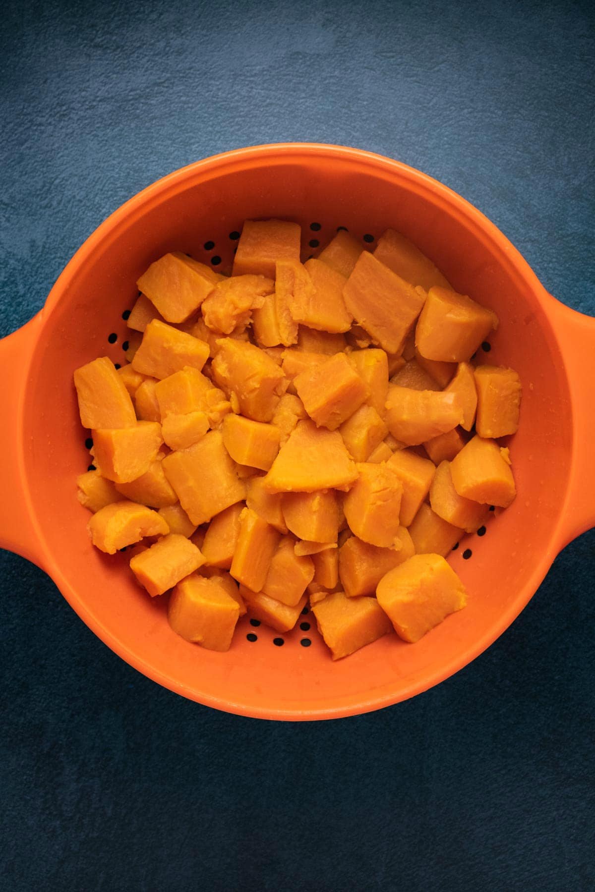 Sweet potatoes in a colander.