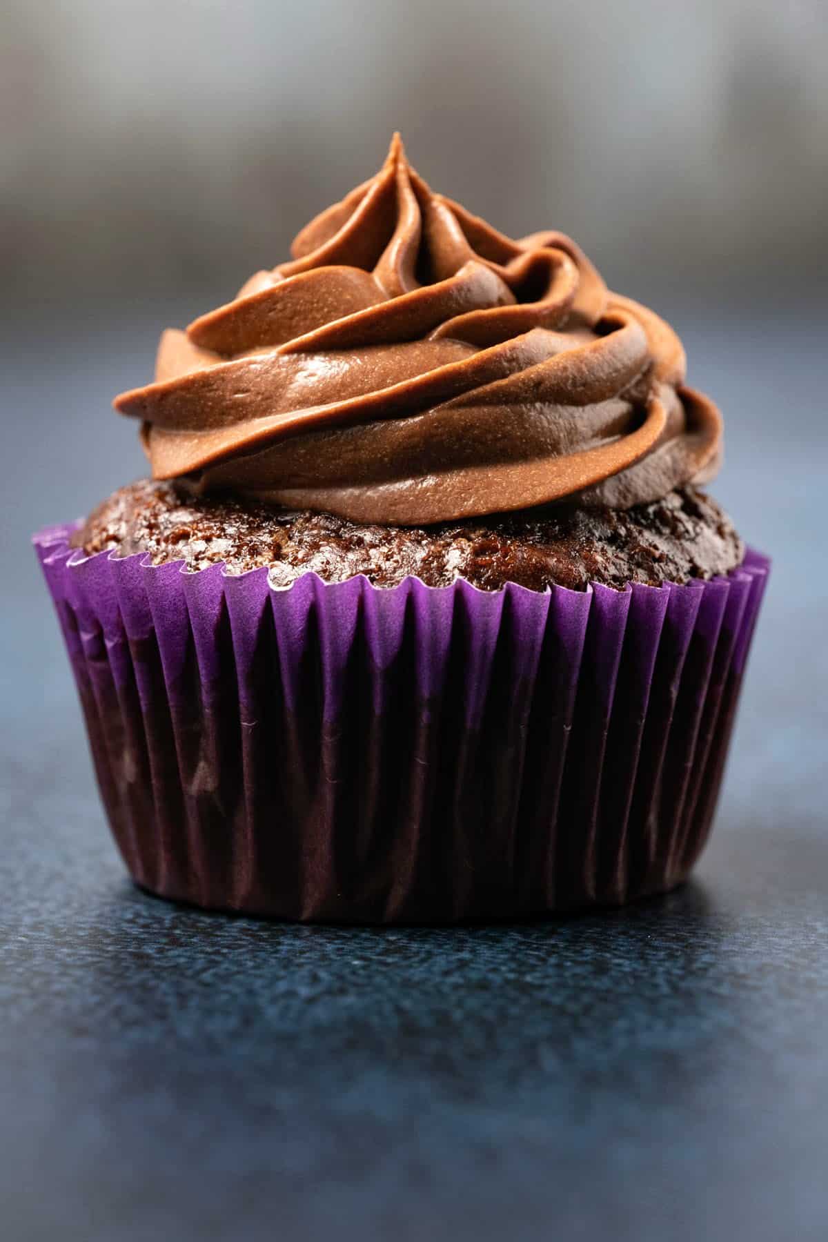 Chocolate cupcake topped with whipped ganache frosting. 