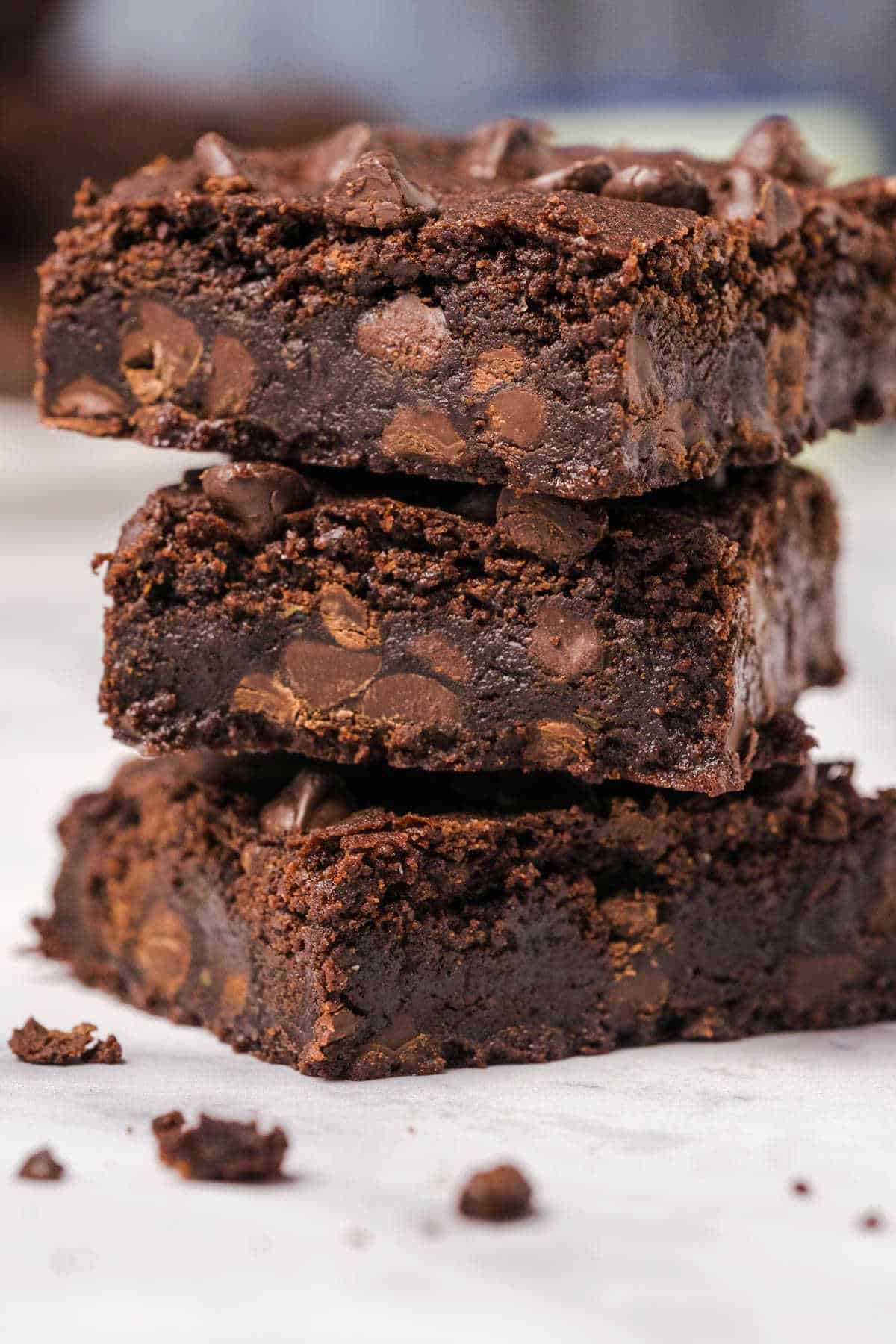 Photo of three brownies stacked up on top of each other. 