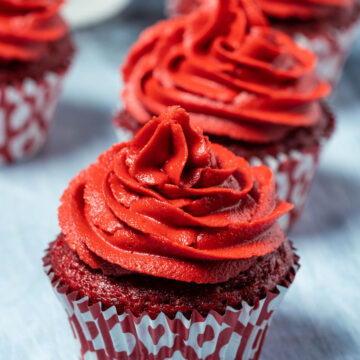 Vegan red velvet cupcakes in a row.