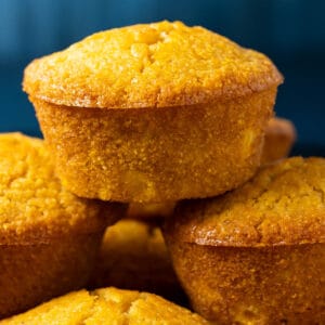 Vegan cornbread muffins in a stack.
