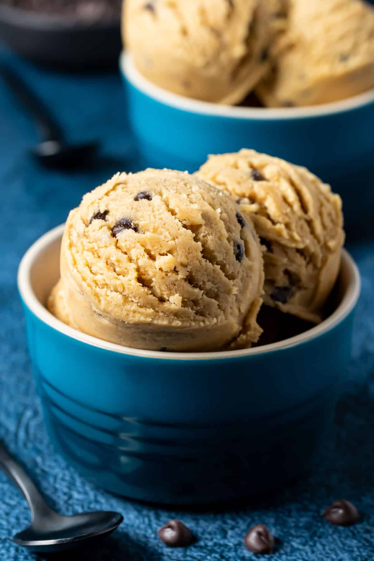 Vegan cookie dough scoops in a blue bowl.