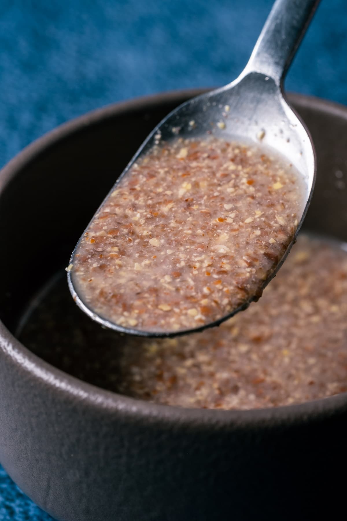 Flax egg in a bowl with a spoon. 