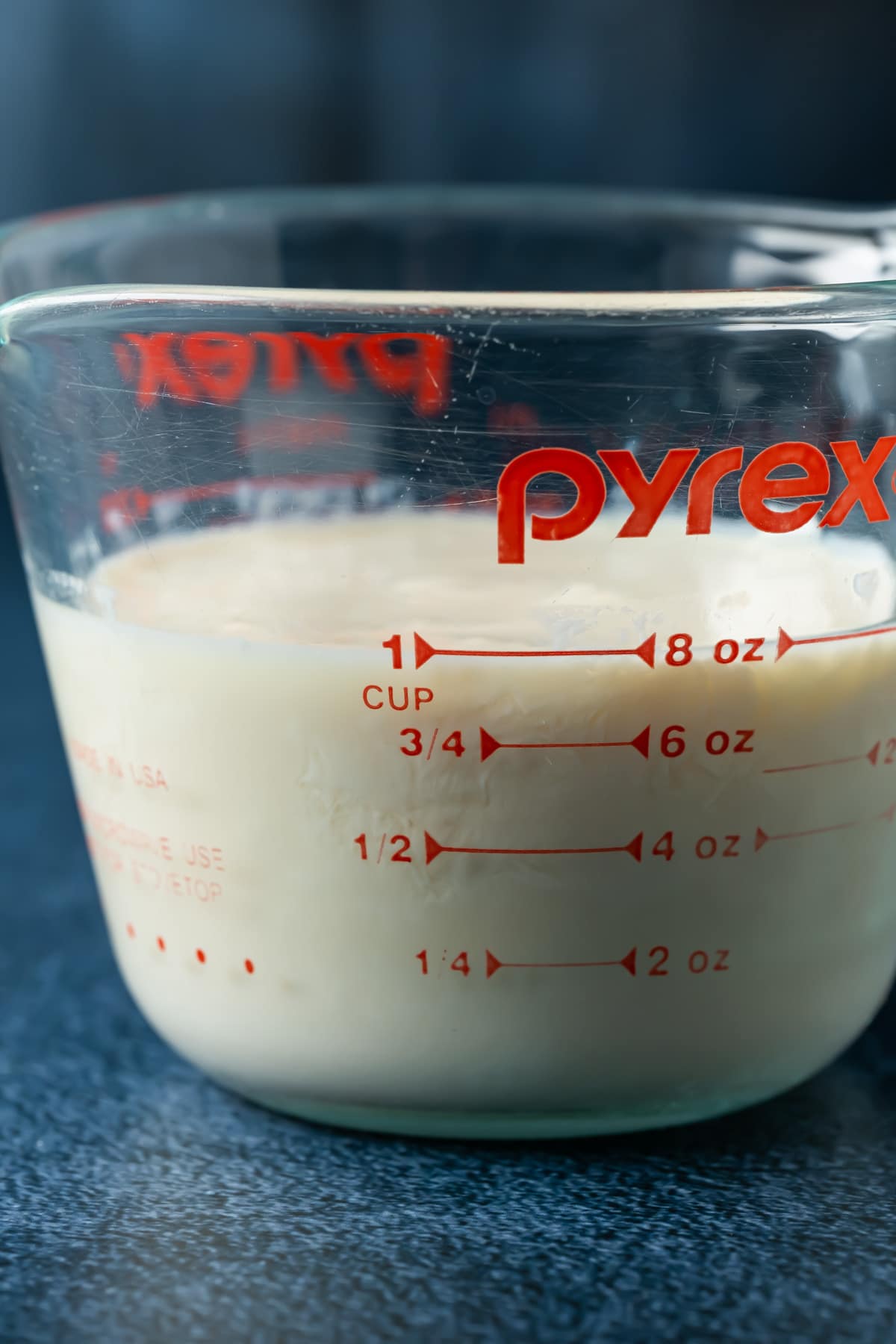 Vegan buttermilk in a glass measuring jug.