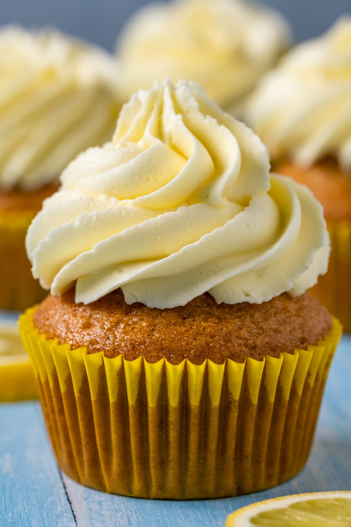 Vegan lemon cupcakes topped with lemon frosting.