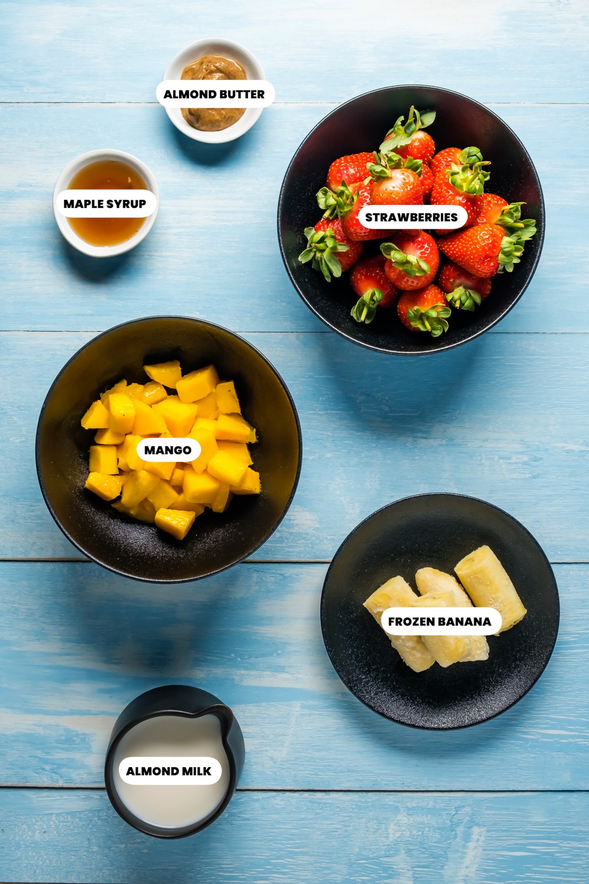 Photo of the ingredients needed to make strawberry mango smoothie.
