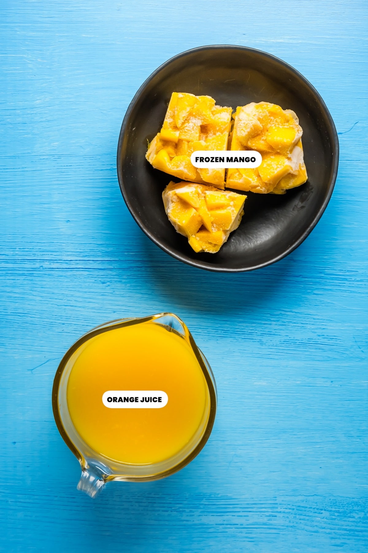 Photo of the ingredients needed to make a mango orange smoothie