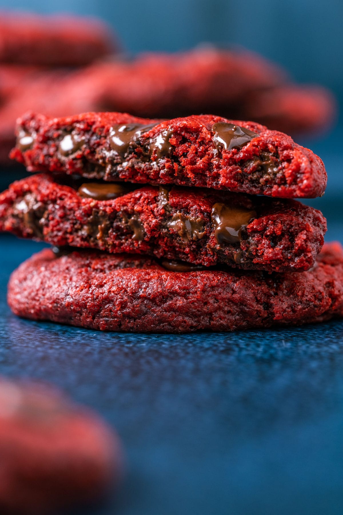 Vegan red velvet cookie broken in half.