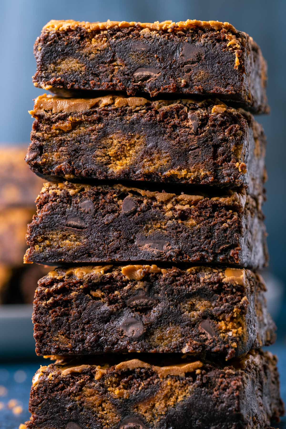 Vegan biscoff brownies in a stack of five.
