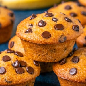 Vegan banana chocolate chip muffins in a stack.