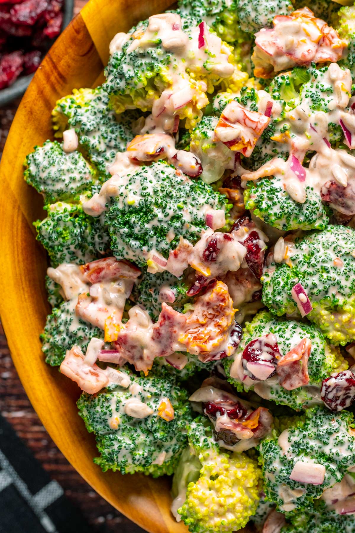 Vegan broccoli salad in a wooden bowl.