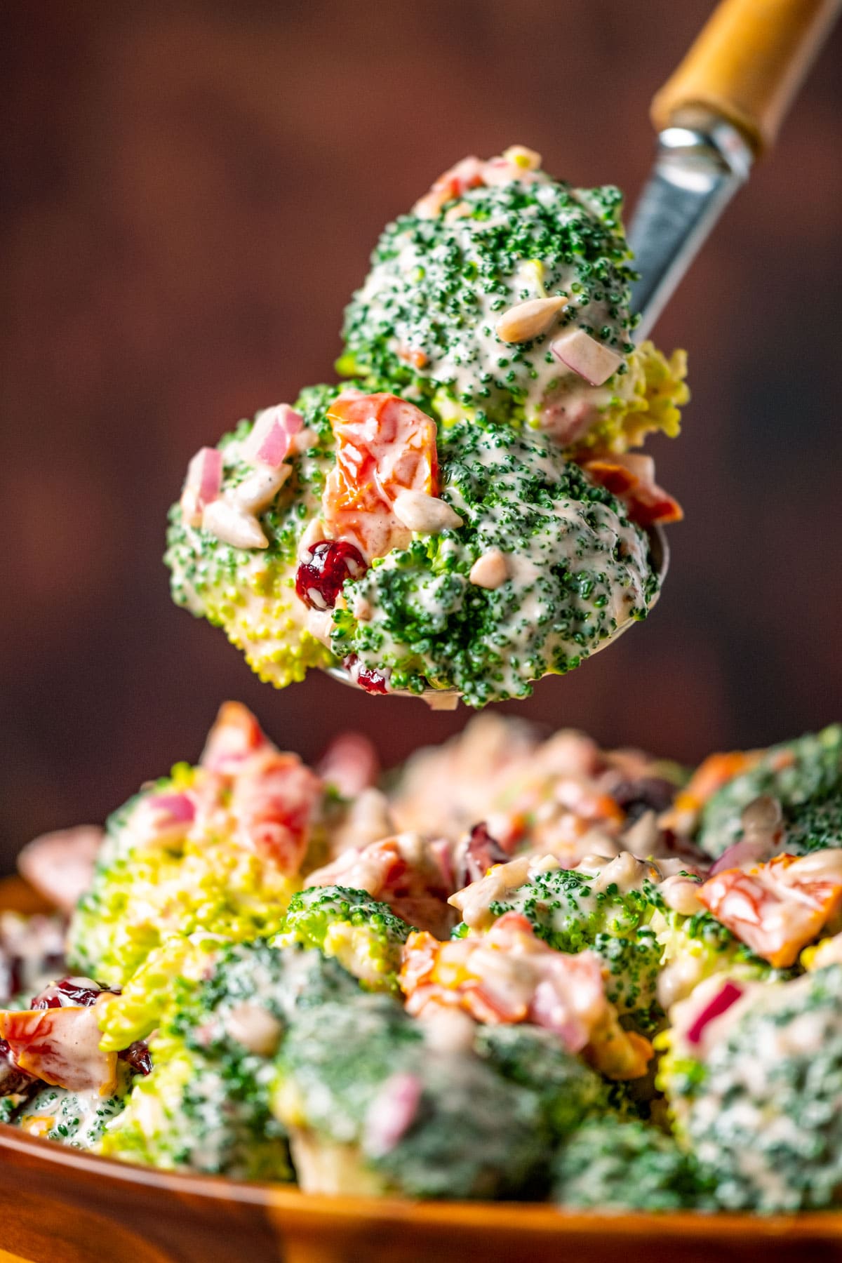 Forkful of vegan broccoli salad.